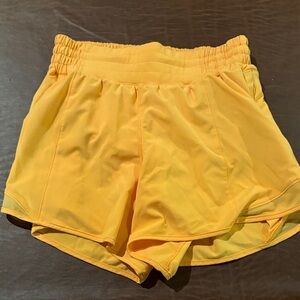 ORANGE Lululemon Hotty Hot 4” High-rise Shorts